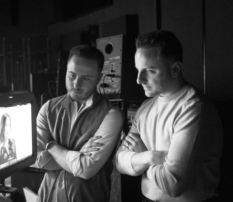 Stephen and Michael Saulpaugh reviewing work in the studio