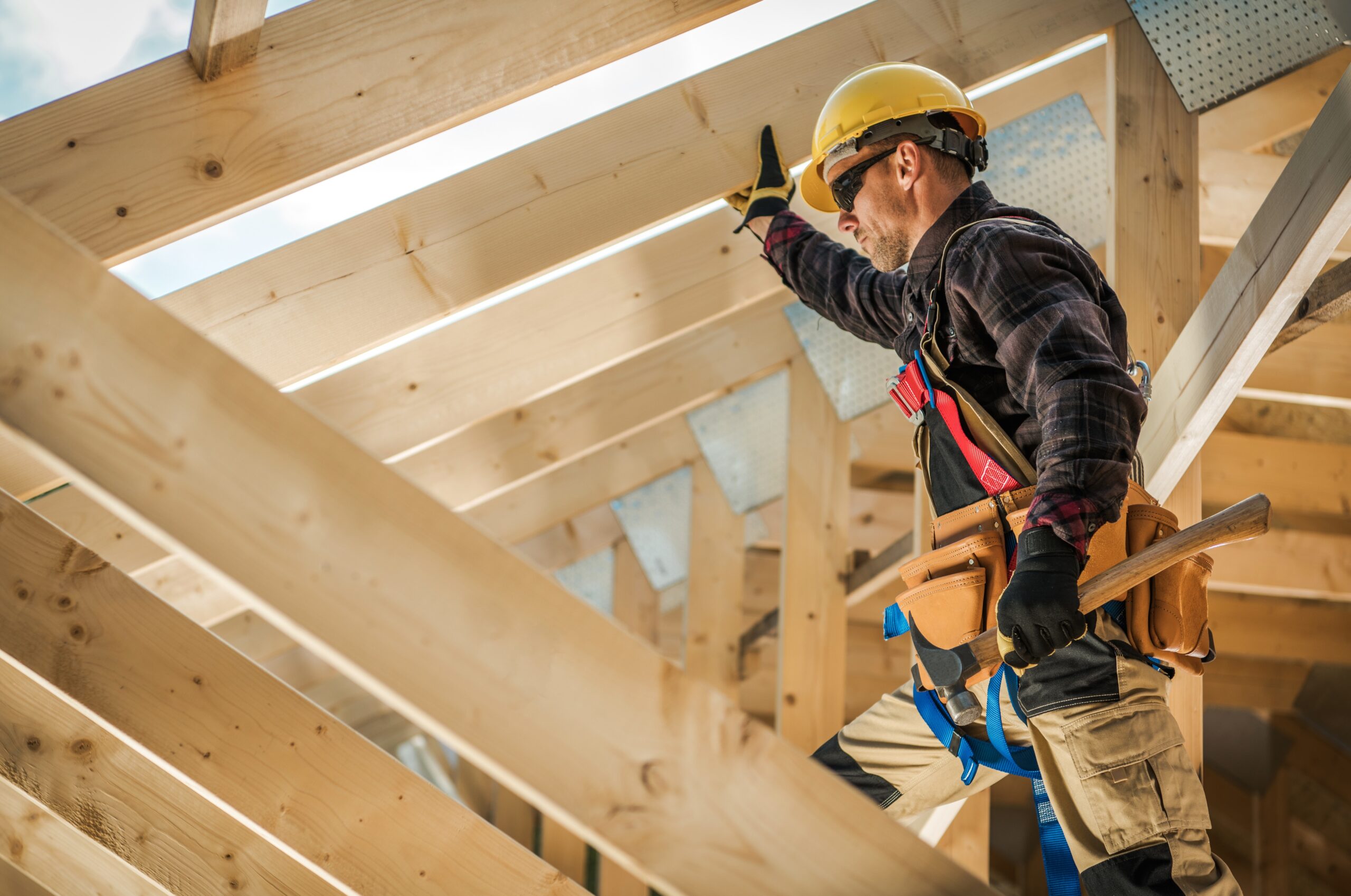 A builder working at a home construction site