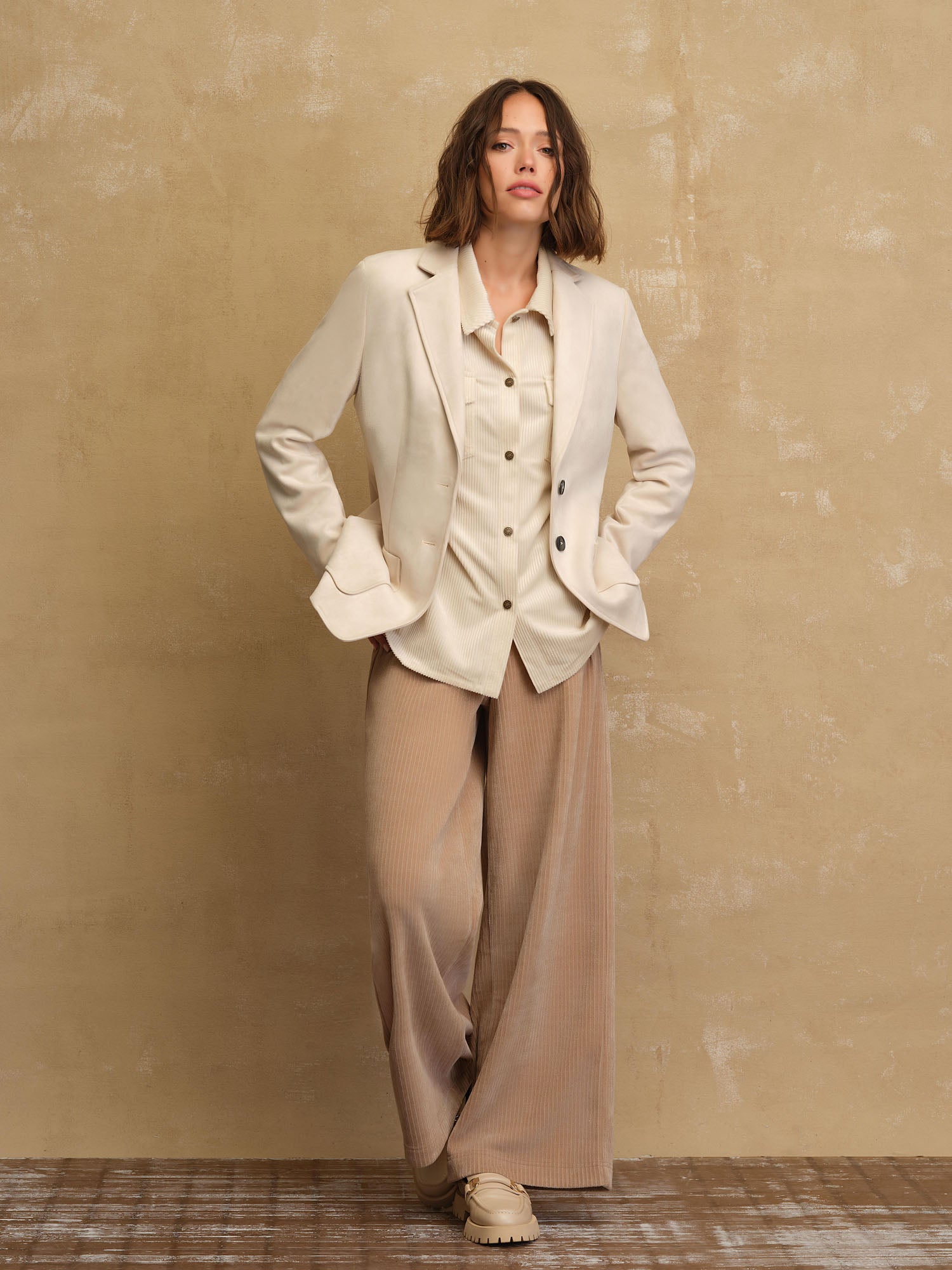 Jane + Mercer model wearing button cord corduroy shirt, blazer and wide-leg pant