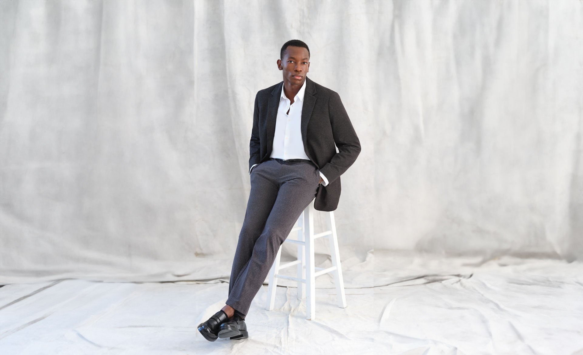 Jane + Mercer model wearing button down shirt, blazer, and dress pants